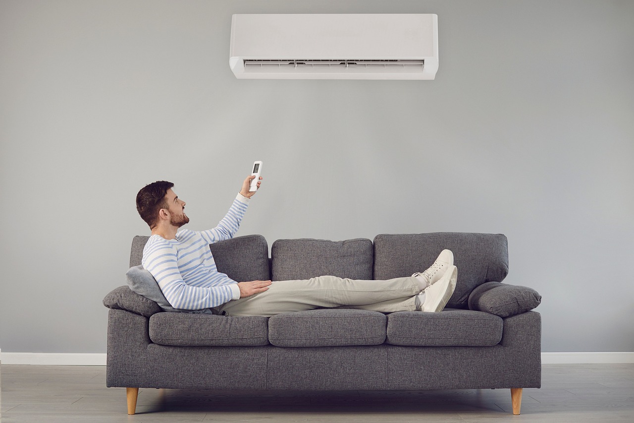 air conditioner, man, sofa-7267527.jpg